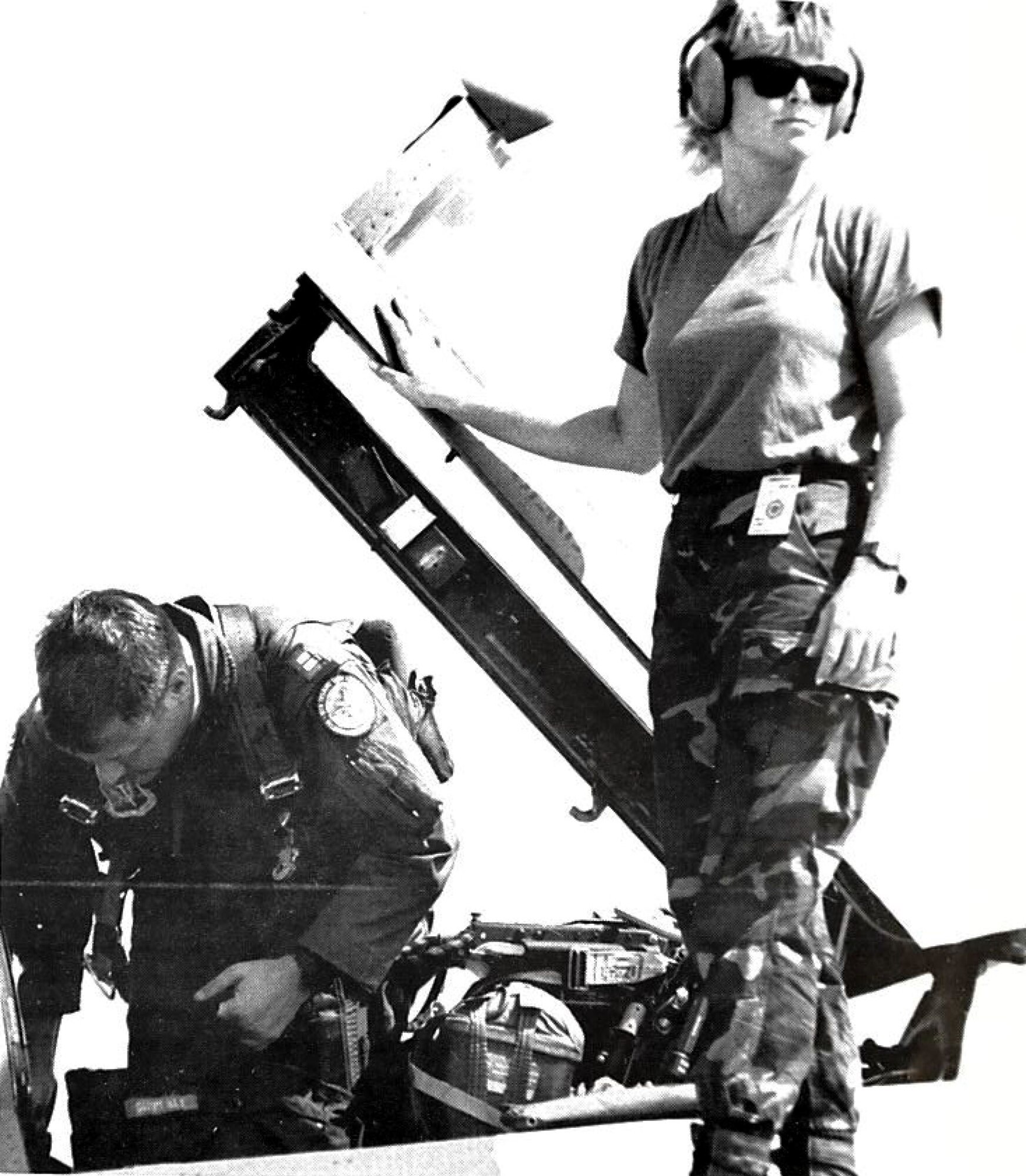 U.S. Air Force Airman 1st Class Leslee Lenoch, 16th Aircraft Maintenance Unit RF-C4 Phantom II crew chief, assists a weapons systems officer prior to takeoff at Reconnaissance Air Meet ’88 at Bergstrom Air Force Base, Texas, December 1988. RAM ’88 was one in a series of Tactical Air Command-sponsored international reconnaissance competitions in which members of Team Shaw competed. (Photo courtesy of 20th Fighter Wing historian) 