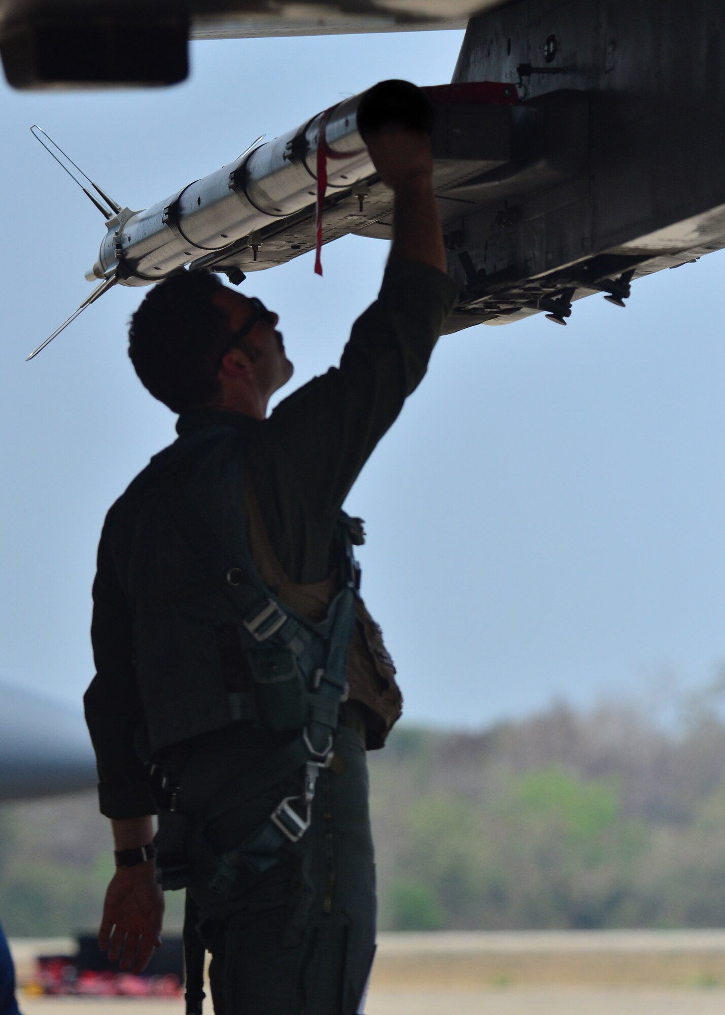 First Lt. Jordan Carr, a pilot for the 67th Fighter Squadron, Kadena Air Base Japan, conducts a preflight inspection of an F-15 Eagle during Exercise Cope Tiger 16, on Korat Royal Thai Air Force Base, Thailand, March 7, 2016. Exercise Cope Tiger 16 includes over 1,200 personnel from three countries and continues the growth of strong, interoperable and beneficial relationships within the Asia-Pacific Region, while demonstrating U.S. capability to project forces strategically in a combined, joint environment. (U.S. Air Force Photo by Tech Sgt. Aaron Oelrich/Released)