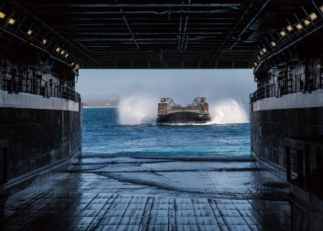 A U.S. Landing Craft Air Cushion with Assault Craft Unit Five, approaches the USS Somerset (LPD 25) off the coast of Marine Corps Base Camp Pendleton, Calif., Feb. 20, 2016, to offload gear and personnel in preparation for the culminating training event of Exercise Iron Fist 2016. The event is a scenario-based, bilateral amphibious assault, between the U.S. Marine Corps and Japan Ground Self-Defense Force, launched from the USS Somerset in coordination with inland airborne troop movements aboard Camp Pendleton. (U.S. Marine Corps photo by Lance Cpl. Devan K. Gowans)