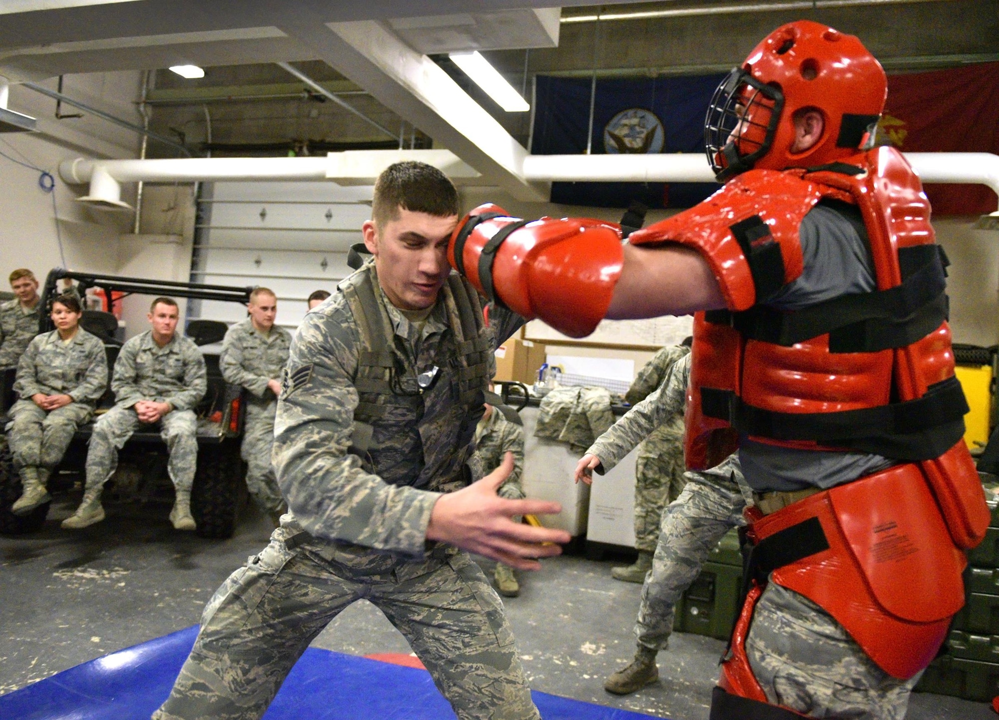 Senior Airman Josh Huber, left, engages in a confrontation with Tech. Sgt. Jason Hutchinson during a full contact training session for the 445th Security Force Squadron during the Feb. 6, 2016 unit training assembly. The combative training is combined with classroom work for the airman to be refreshed on the different levels of escalation and de-escalation while dealing with uncooperative persons.