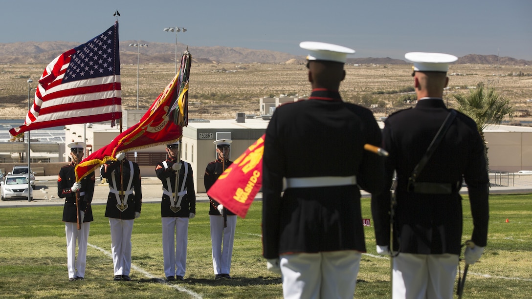 The Official Marine Corps Color Guard of the Battle Color Detachment presents the national colors during the playing of the national anthem as part of a Battle Color Ceremony at Marine Corps Air Ground Combat Center Twentynine Palms, California March 9, 2016. The battle color ceremony features the U.S. Marine Drum & Bugle Corps, the Silent Drill Platoon, and the Marine Corps Color Guard.
