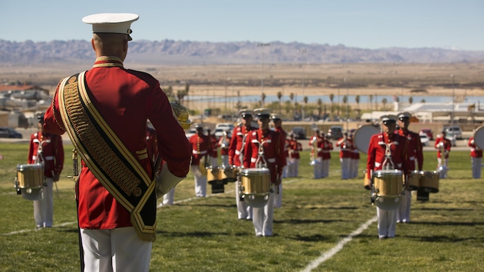The U.S. Marine Corps Drum and Bugle Corps, also known as "The Commandant's Own," performs during a Battle Color Ceremony at Marine Corps Air Ground Combat Center Twentynine Palms, California March 9, 2016. The battle color ceremony features the U.S. Marine Drum & Bugle Corps, the Silent Drill Platoon and the Marine Corps Color Guard.