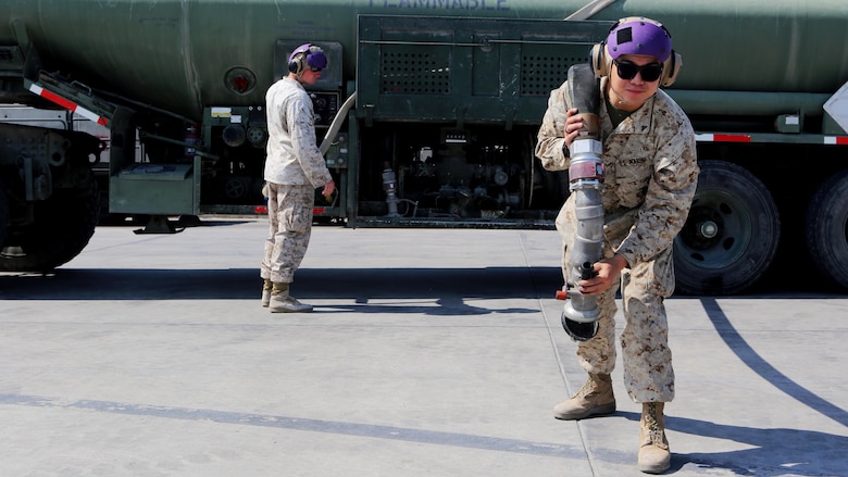 U.S. Marine bulk fuel specialists with Marine Wing Support Squadron 372, Special Purpose Marine Air Ground Task Force-Crisis Response-Central Command, prepare to refuel an aircraft at an undisclosed location in Southwest Asia, Feb. 21, 2016. Aircraft refueling is just one of the many capabilities that MWSS-372 provides for the aviation combat element. The squadron is currently supporting the Aviation Combat Element with SPMAGTF-CR-CC in support of Operation Inherent Resolve.
