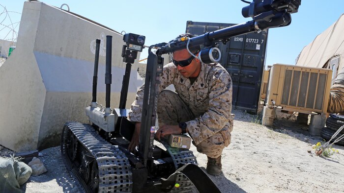 U.S. Marine Sgt. Juan Cerna, an explosive ordnance disposal technician with Marine Wing Support Squadron 372, Special Purpose Marine Air Ground Task Force-Crisis Response-Central Command, changes the batteries in a Talon Mark II robot at an undisclosed location in Southwest Asia, Feb. 20, 2016. The EOD technicians are present to provide the base and airfield with the ability to handle unexploded ordnance, hung ordnance, or suspicious packages.