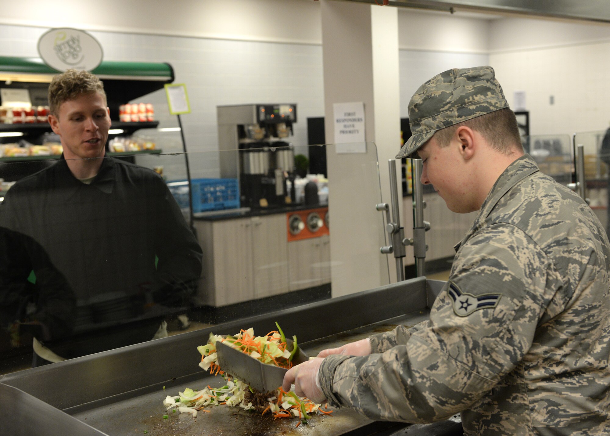 Red River Dining Facility personnel from the 2nd Force Support Squadron worked to ensure Airmen were fed amid flash flood conditions at Barksdale Air Force Base, La., March 9, 2016. (U.S. Air Force photo/Airman 1st Class Curt Beach)