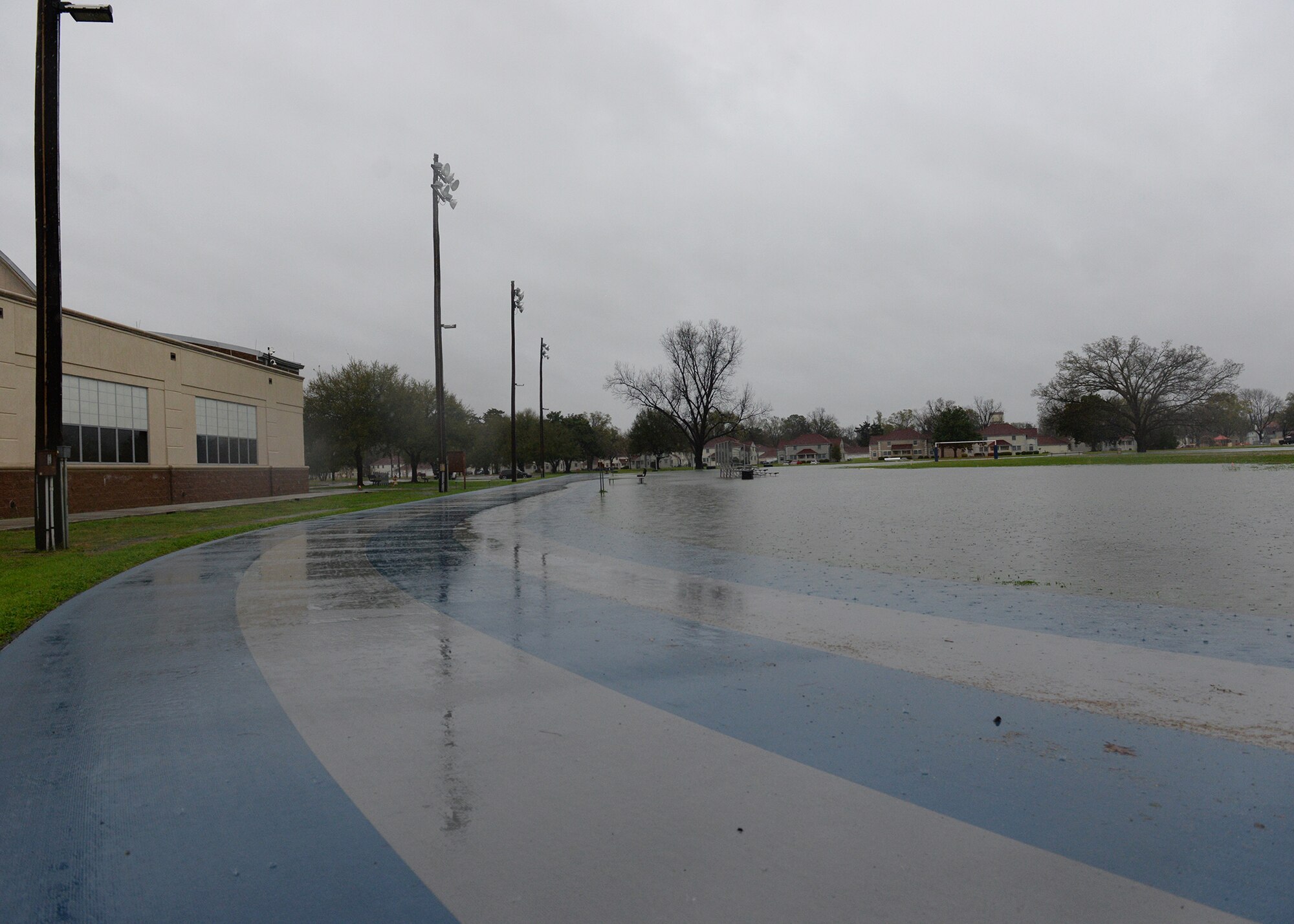 The SrA Bryan Bell Fitness Center track and field are hit with heavy rain amid flash flood conditions at Barksdale Air Force Base, La., March 9, 2016. (U.S. Air Force photo/Airman 1st Class Curt Beach)