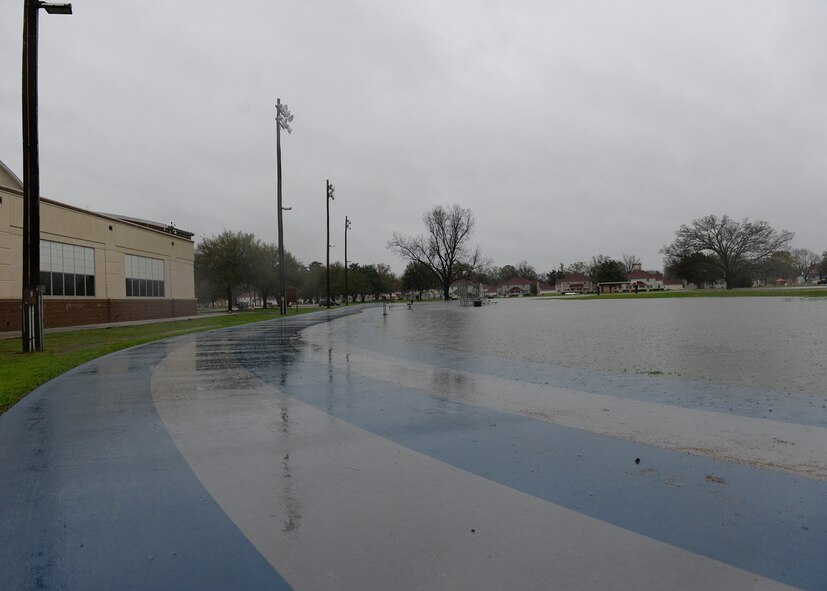 The SrA Bryan Bell Fitness Center track and field are hit with heavy rain amid flash flood conditions at Barksdale Air Force Base, La., March 9, 2016. (U.S. Air Force photo/Airman 1st Class Curt Beach)