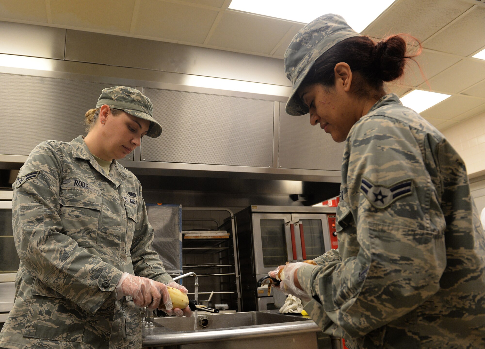 Red River Dining Facility personnel from the 2nd Force Support Squadron prepare meals for Airmen amid flash flood conditions at Barksdale Air Force Base, La., March 9, 2016. (U.S. Air Force photo/Airman 1st Class Curt Beach)