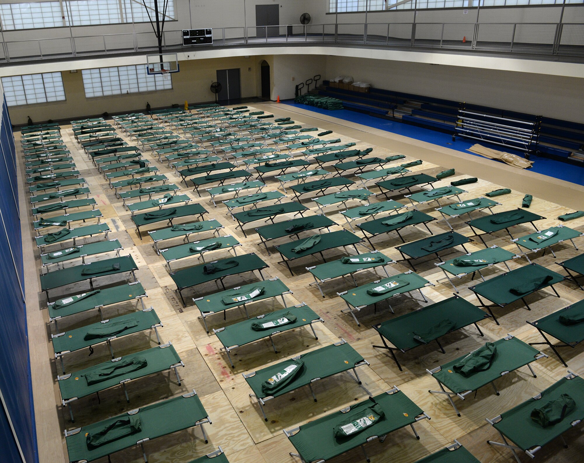 The SrA Bryan Bell Fitness Center opened its doors as a shelter for community flash flood evacuees and set up more than 250 cots at Barksdale Air Force Base, La., March 9, 2016. More than 35 evacuees took refuge at the fitness center. (U.S. Air Force photo/Airman 1st Class Curt Beach)