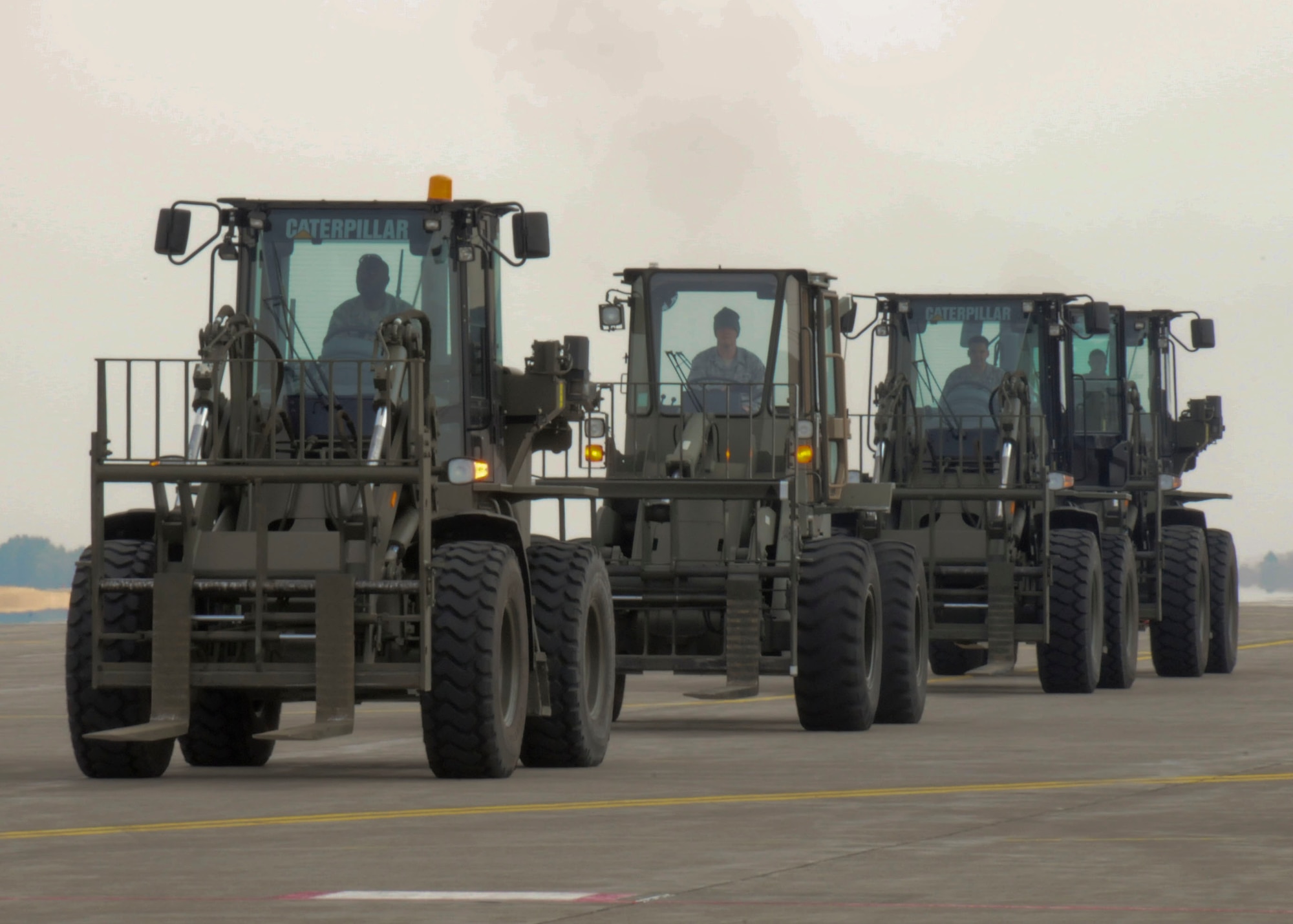 Forklifts line the flightline here waiting to offload cargo March 30. Since Operation Tomodachi kicked-off, Misawa Air Base has received more than a million pounds of cargo in support of earthquake and tsunami relief operations. (U.S. Air Force photo by Staff Sgt. Rachel Martinez/Released) 