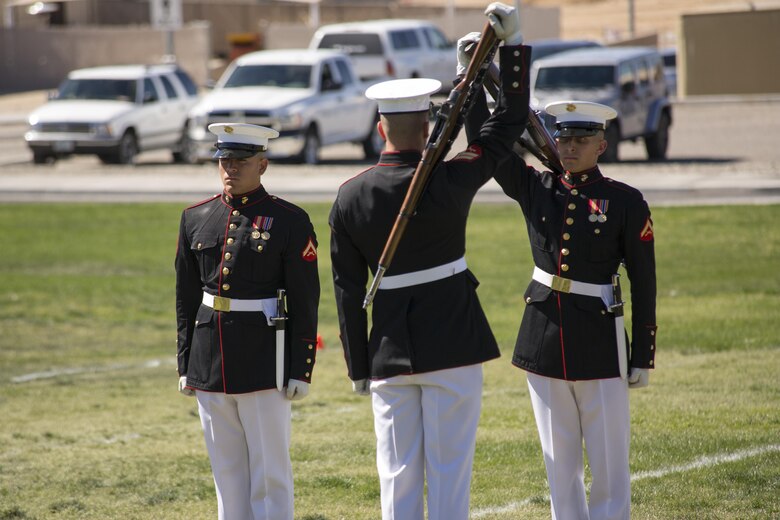 Marines with the Silent Drill Platoon of the Battle Color Detachment prepare to exchange rifles during a Battle Color Ceremony at Lance Cpl. Torrey L. Gray Field March 9, 2016. (Official Marine Corps photo by Lance Cpl. Levi Schultz/Released)