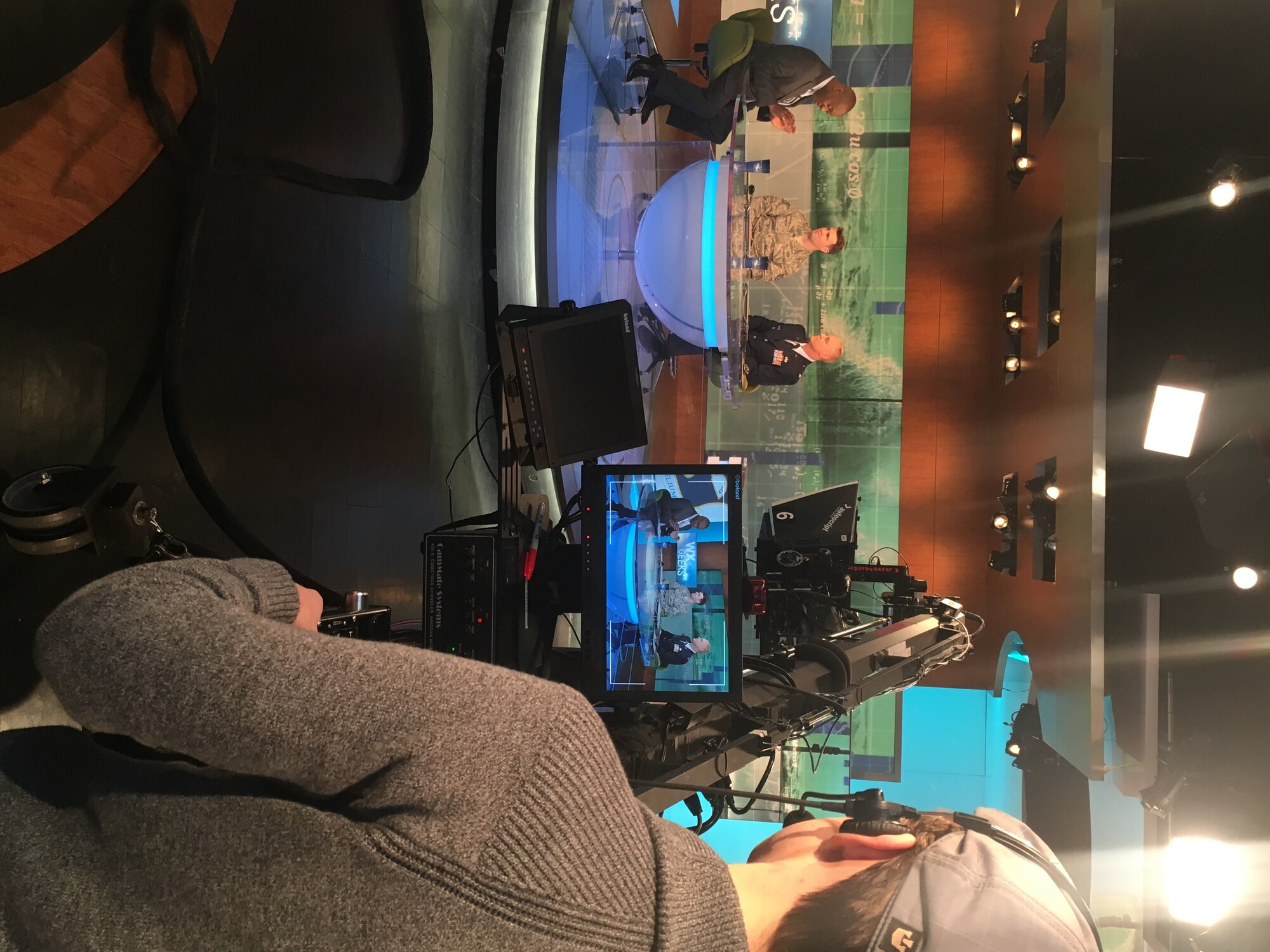 Dr. Marshall Shepherd, host of the Weather Channel’s “Weather Geeks” show, interviews Lt. Col. James Weaver, deputy commander of the 2nd Weather Group, and Staff Sgt. Trevor Reiss, a weather forecaster assigned to the 21st Operational Weather Squadron, Feb. 25, at the Weather Channel studio in Atlanta, Ga. Weaver and Reiss were invited to star on the show and discuss the unique mission of the 557th Weather Wing, formerly known as the Air Force Weather Agency, and describe what the daily job is like as a forecaster supporting military operations. (U.S. Air Force photo by 1st Lt. Carrie Volpe/Released)