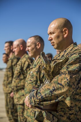 Gunnery Sgt. Carlos Aguilar, right, stands in formation with his peers after receiving an award in recognition of his leadership during a ceremony at Marine Fighter Attack Squadron 312 aboard Marine Corps Air Station Beaufort March 2.  During the ceremony, Aguilar was presented with the Navy & Marine Association Leadership Award, a peer-selected recognition. The association sponsors more than 400 awards annually for commanders to recognize officers and enlisted personnel who have been selected by their peers as outstanding leaders in their respective communities. Aguilar is a maintenance controller with VMFA-312. 
