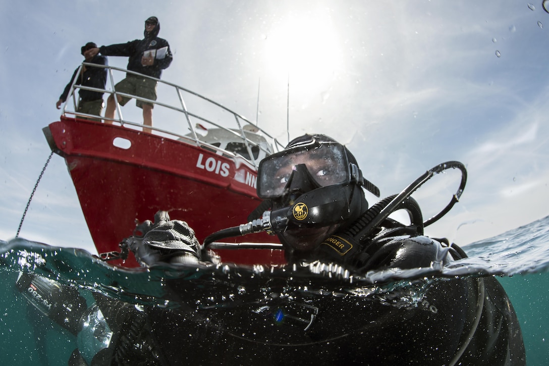 Navy Petty Officer 3rd Class Antonio Coffield prepares to dive underwater for photography training off the coast of San Diego, March 3, 2016. Navy Combat Camera has the Department of Defense's only underwater photography and videography capability. Navy photo by Petty Officer 2nd Class Arthurgwain L. Marquez
