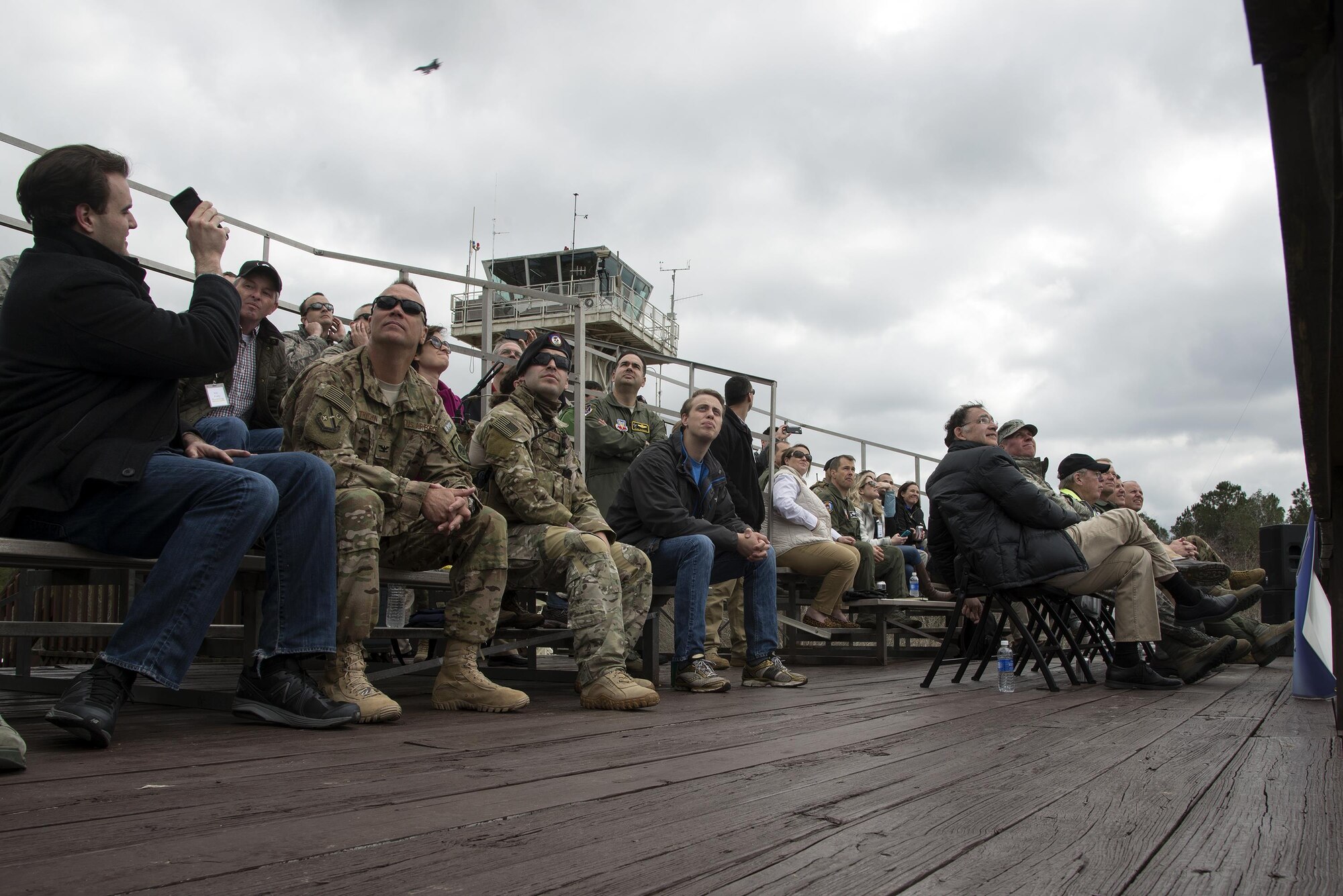 A crowd watches a pair of F-16C Fighting Falcons soar through the sky during an East Coast Air Power Demonstration, March 4, 2016, at Moody Air Force Base, Ga. During the visit, congressional delegates viewed multiple aircraft perform a simulated combat search and rescue and close air support operation. (U.S. Air Force photo by Airman 1st Class Janiqua P. Robinson/Released)
