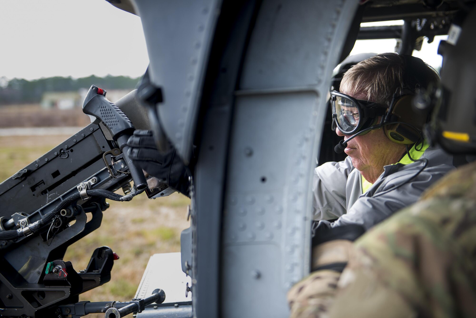 Johnny Isakson, Georgia senator, sits in the aerial gunner seat on an HH60G Pave Hawk during the East Coast Airpower Demonstration, at Moody Air Force Base, Ga., March 4, 2015. The East Coast Air Power Demonstration allowed the delegation to spend the day with Airmen and get a firsthand look at the mission, capabilities and platforms that the Air Force provides to combatant commanders in support of global operations. (U.S. Air Force photo by Senior Airman Ryan Callaghan/Released)