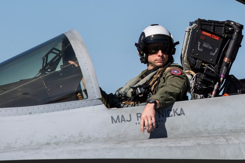 An F/A-18C Hornet pilot prepare for take-off on the flight line aboard Marine Corps Air Station Beaufort March 7. Marine Fighter Attack Squadron 122 departed for the Western Pa¬cific March 7 as part of the Unit Deployment Program. The squadron will sup¬port 6 multinational ex¬ercises, which will not only increase the readi¬ness of the Marines but safeguard international goodwill and ensure we can work with our allies effectively. The pilot is with VMFA-122.