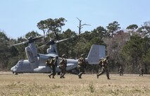 Marines with Echo Company, 2nd Battalion, 8th Marine Regiment, exit an MV-22B Osprey during a field exercise at Camp Lejeune, N.C., March 10, 2016. The aircraft, operated by Marines with Marine Medium Tiltrotor Squadron 266, assisted the company in making an aerial insert. (U.S. Marine Corps photo by Cpl. Paul S. Martinez/Released)