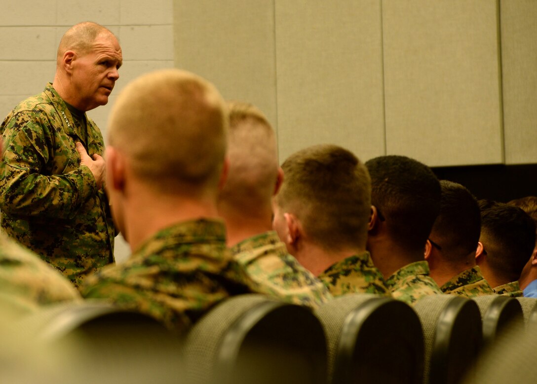 General Robert B. Neller, commandant of the Marine Corps, speaks to Marines and Sailors  a town hall meeting during his first official visit to Marine Corps Logistics Base Albany, March 9.  