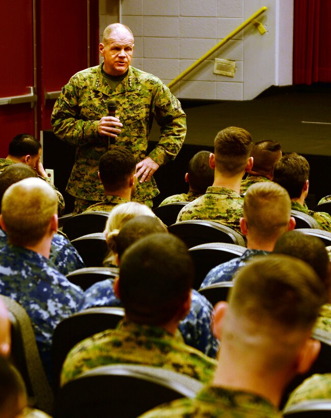 General Robert B. Neller, commandant of the Marine Corps, addresses Marines and Sailors at a town hall meeting during his first official visit to Marine Corps Logistics Base Albany, March 9.  