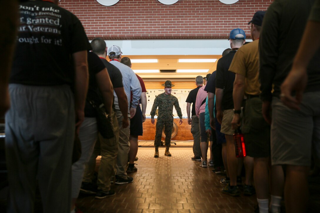 U.S. Marine Corps Sgt. Justin Smith, a drill instructor with Fox Co. 2nd Recruit Training Battalion, explains to educators, during the Educators’ Workshop, what recruits experience during their first day aboard Marine Corps Recruit Depot Parris Island, S.C., March 9, 2016. The educators, from Pennsylvania, New York, and Vermont, were brought to Parris Island to get a small glimpse of what it takes to earn the title United States Marine. (U.S. Marine Corps photo by Sgt. Elizabeth Thurston/Released)