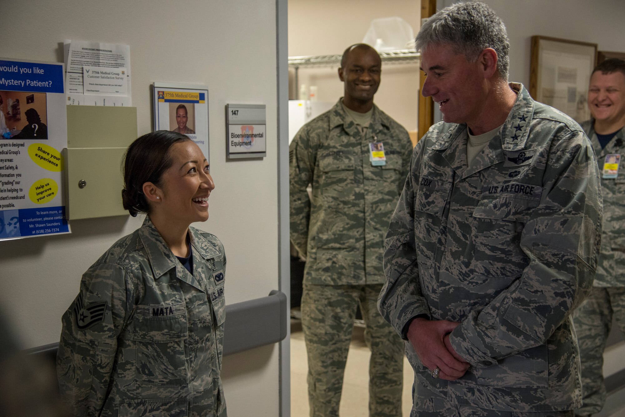 Lt. Gen. Sam Cox, 18th Air Force commander, asks Staff Sgt. MaryJo Mata, 375th Aerospace Medicine Squadron, about her home town Mar. 4, 2016, at Scott Air Force Base, Ill. During Cox’s visit to the Bioenvironmental Engineering Flight, learned about their important role providing expertise on occupational and environmental health, surveilling work centers, providing quantitative gas mask and respirator fit tests and monitoring heat stress conditions during the summer months. (U.S. Air Force photo/Senior Airman Jake Eckhardt)