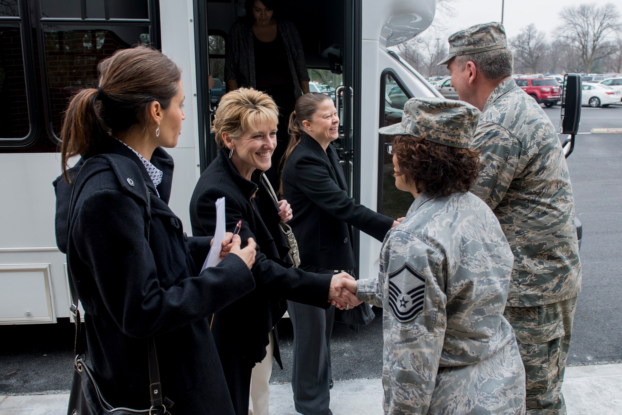 Tammy Cox, wife of 18th Air Force commander Lt. Gen. Sam Cox, alongside Brandy Petzel, wife of 18th AF Command Chief Master Sgt. Todd Petzel, are greeted by Chaplain (Col.) James Richey, 375th Air Mobility Wing chaplain, and Master Sgt. Esmeralda Aharon, 375th AMW chaplain superintendent, during their visit to the chapel Mar. 4, 2016 at Scott Air Force Base, Ill. Cox was briefed on the various religious opportunities and initiatives available to the base, such as spiritual retreats for men and women, and ones for single individuals or couples. Cox applauded the efforts of the chapel staff and the services they provide. (U.S. Air Force Photo/Senior Airman Joshua Eikren))  
