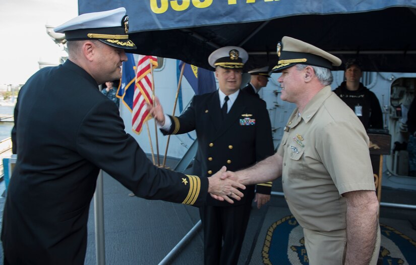 Capt. Timothy Sparks (right) greets Cmdr. Casey Baker, aboard the USS
Farragut, a U.S. Navy destroyer whose homeport is Naval Station Mayport,
Florida, March 10, 2016, at Charleston, South Carolina after completing an
exercise near the Atlantic Coast.. Joint Base Charleston leadership greeted
the ship upon arrival. While visiting, the ship will provide training
opportunities to students attending The Citadel, the military college of S.C.,
(U.S. Air Force photo/Staff Sgt. Jared Trimarchi)

