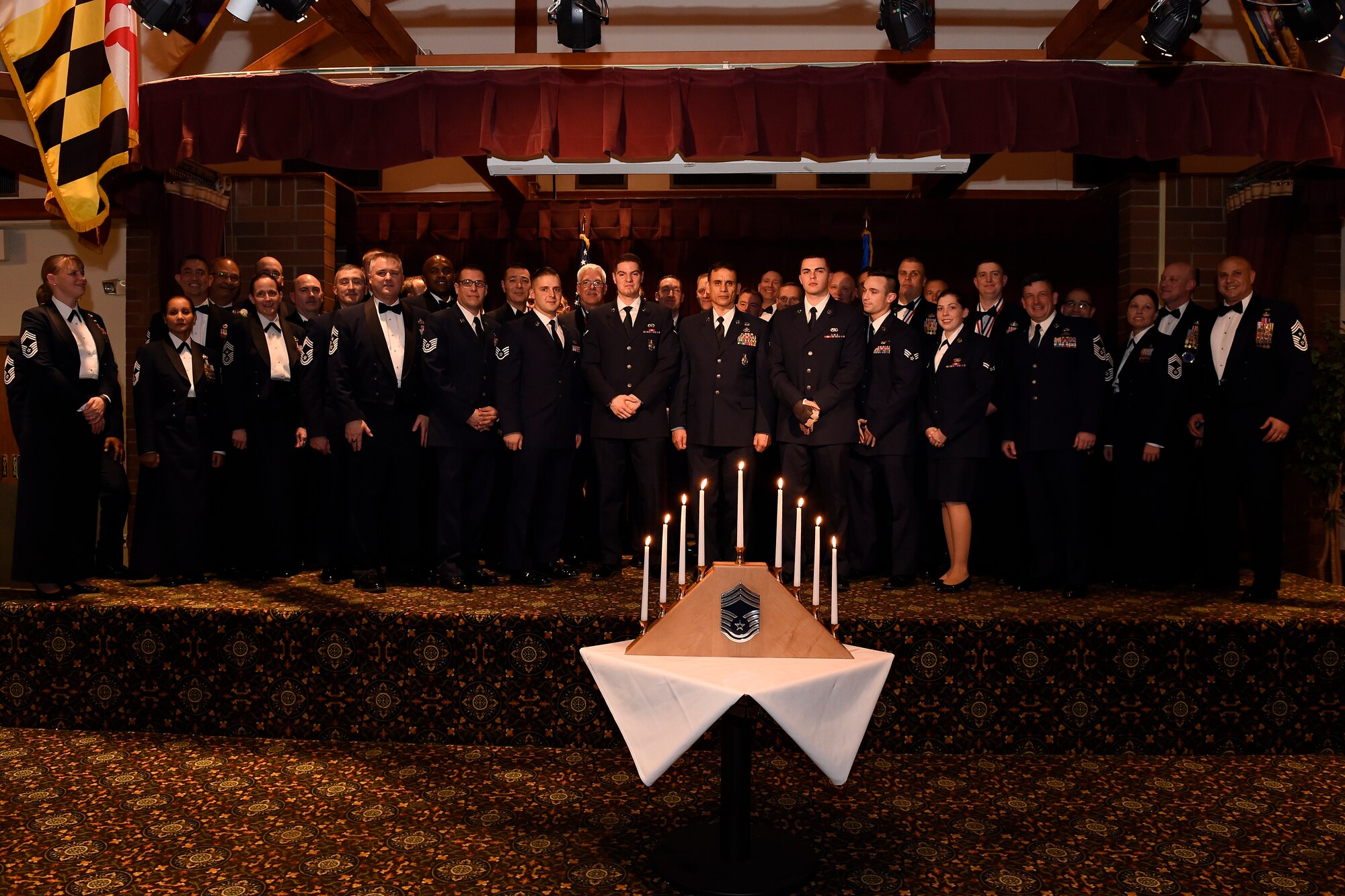 Chief master sergeants, chief master sergeant selects and the candle lighters, pose for a photo during the chief master sergeant induction ceremony March 4, 2016, at Joint Base Lewis-McChord, Wash. 10 Airmen from Team McChord active duty Air Force, Air Force Reserves and the Air National Guard were recognized at the ceremony for making it to the rank of chief master sergeant.  (U.S. Air Force photo/Tech. Sgt. Tim Chacon)  