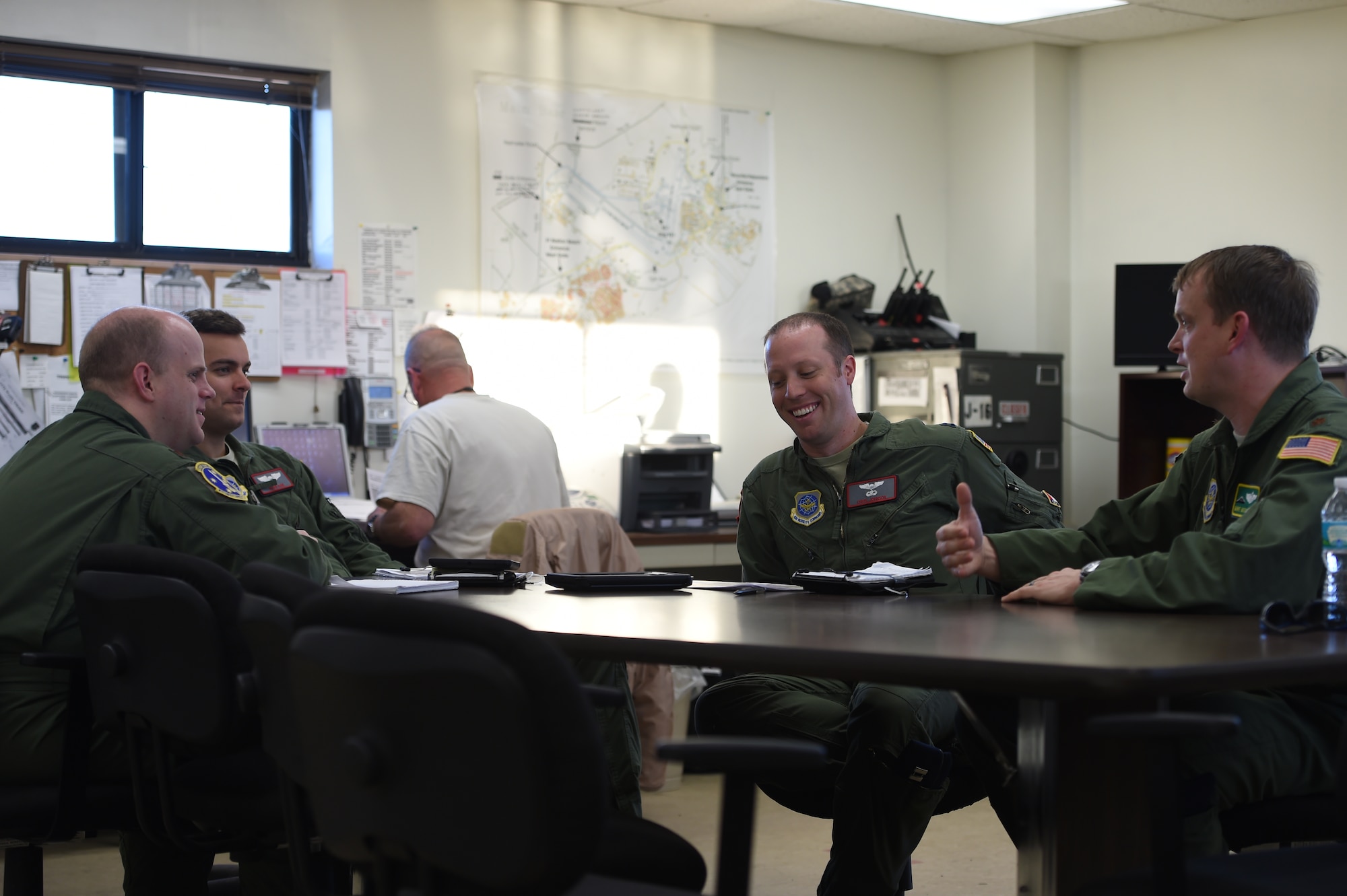 C-5 aircrew from Travis Air Force Base, Calif., and C-17 aircrew from Joint Base Lewis-McChord, Wash., talk prior to flying a mission over test range at Eglin AFB, Fla., March 4, 2016. The two aircrews flew to Eglin to test the aircraft defense systems as part of Air Mobility Command’s flare effectiveness testing. The crews spent more than eight nights ejecting the flares from their aircraft so a team on the ground from AMC and Georgia Tech Research Institute and other partners could analyze the results of the test. (U.S. Air Force photo/Staff Sgt. Naomi Shipley)