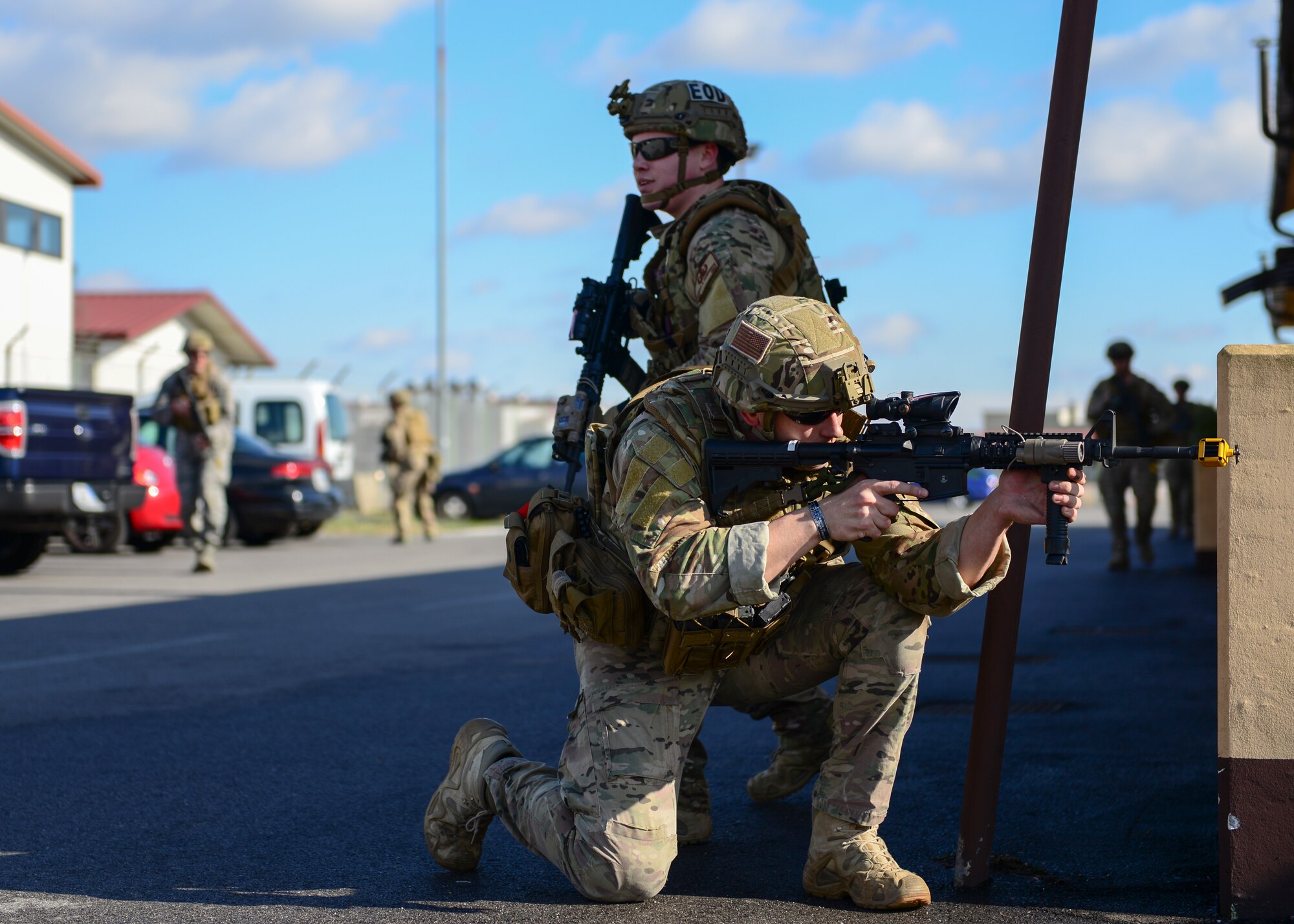 (From front to back) Staff Sgt. Lee Cundiff, 31st Civil Engineer Squadron Explosive Ordinance Disposal craftsman, and Senior Airman Josiah Hamernick, 31st CES EOD journeyman, participate in small unit tactics training March 1, 2015, at Aviano Air Base, Italy. The training included how to move in formations based on the terrain and situation. (U.S. Air Force photo by Airman 1st Class Cory W. Bush/Released)