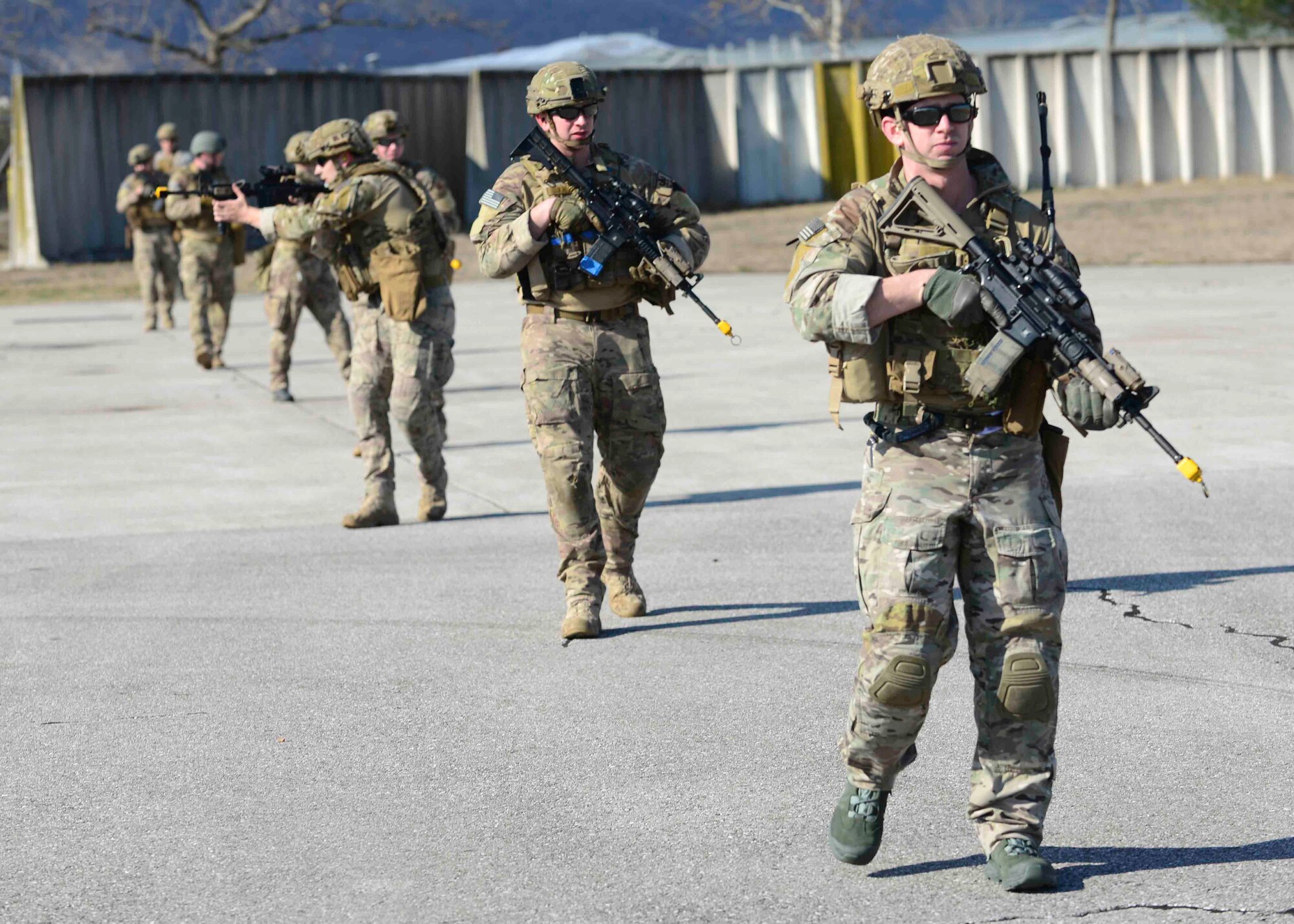 Airmen from the 31st Civil Engineer Squadron Explosive Ordinance Disposal flight, move in file during small unit tactics training March 1, 2015, at Aviano Air Base, Italy. The skills taught during training are critical when working with conventional and unconventional forces. (U.S. Air Force photo by Airman 1st Class Cory W. Bush/Released)