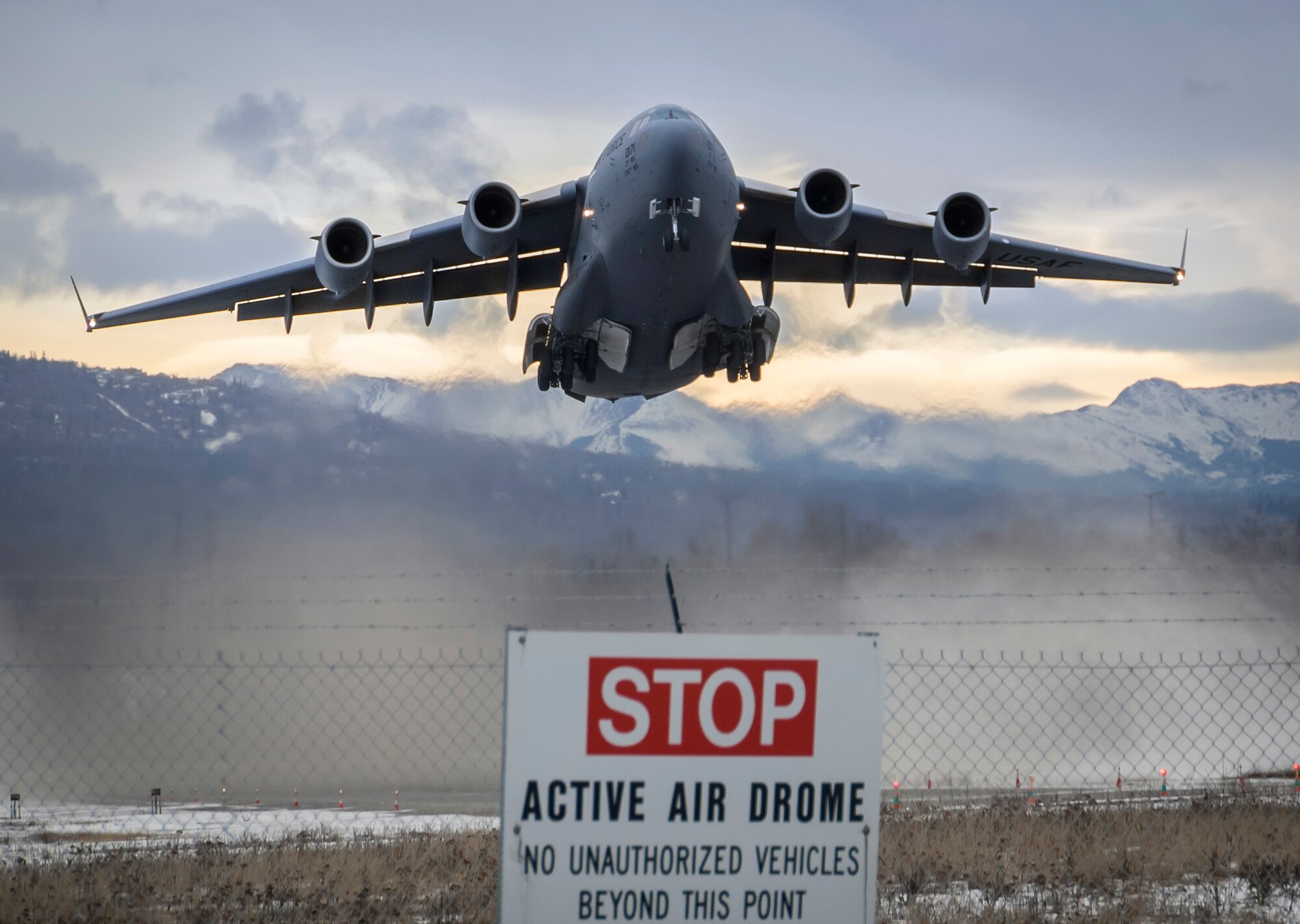 A C-17 Globemaster III aircraft of the 517th Airlift Squadron takes off from Bryant Army Airfield on Joint Base Elmendorf-Richardson, Alaska, Monday, March 7, 2016, while practicing landing and taking off from a short runway. The event marked the first time a C-17 has taken off from the airfield since its construction in 1958, when the runway was built by the U.S. Army on then-separate Ft. Richardson to support Soldiers in remote areas of Alaska. (U.S. Air Force photo/Justin Connaher)