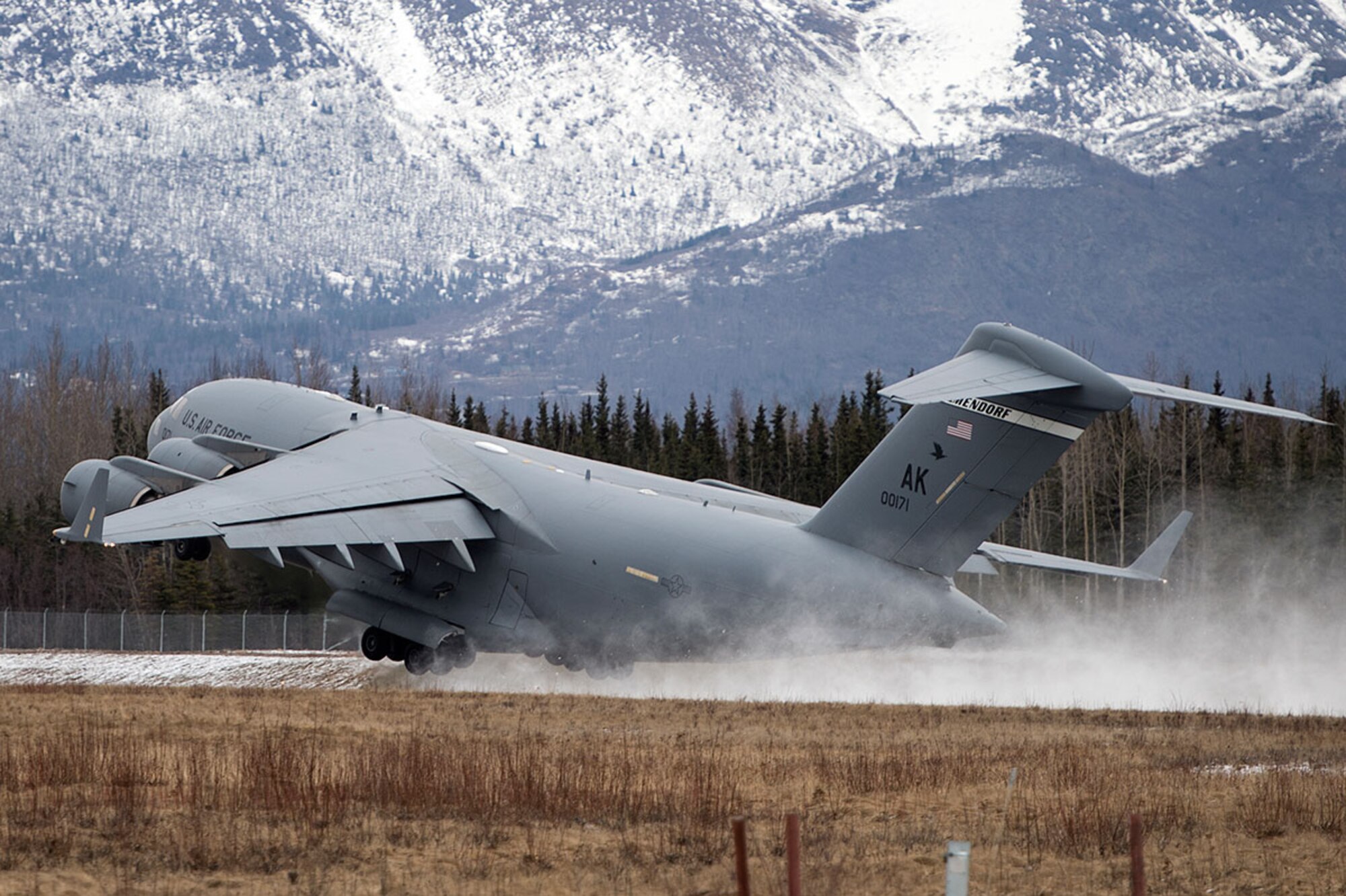 A U.S. Air Force C-17 Globemaster III from the 517th Airlift Squadron takes off from Bryant Army Air Field on Joint Base Elmendorf-Richardson, Alaska,  March 7, 2016.  The event marked the first time a C-17 has taken off from the airfield since its construction in 1958, when the runway was built by the U.S. Army on then-separate Ft. Richardson to support Soldiers in remote areas of Alaska. (U.S. Air Force photo by Senior Airman James Richardson)