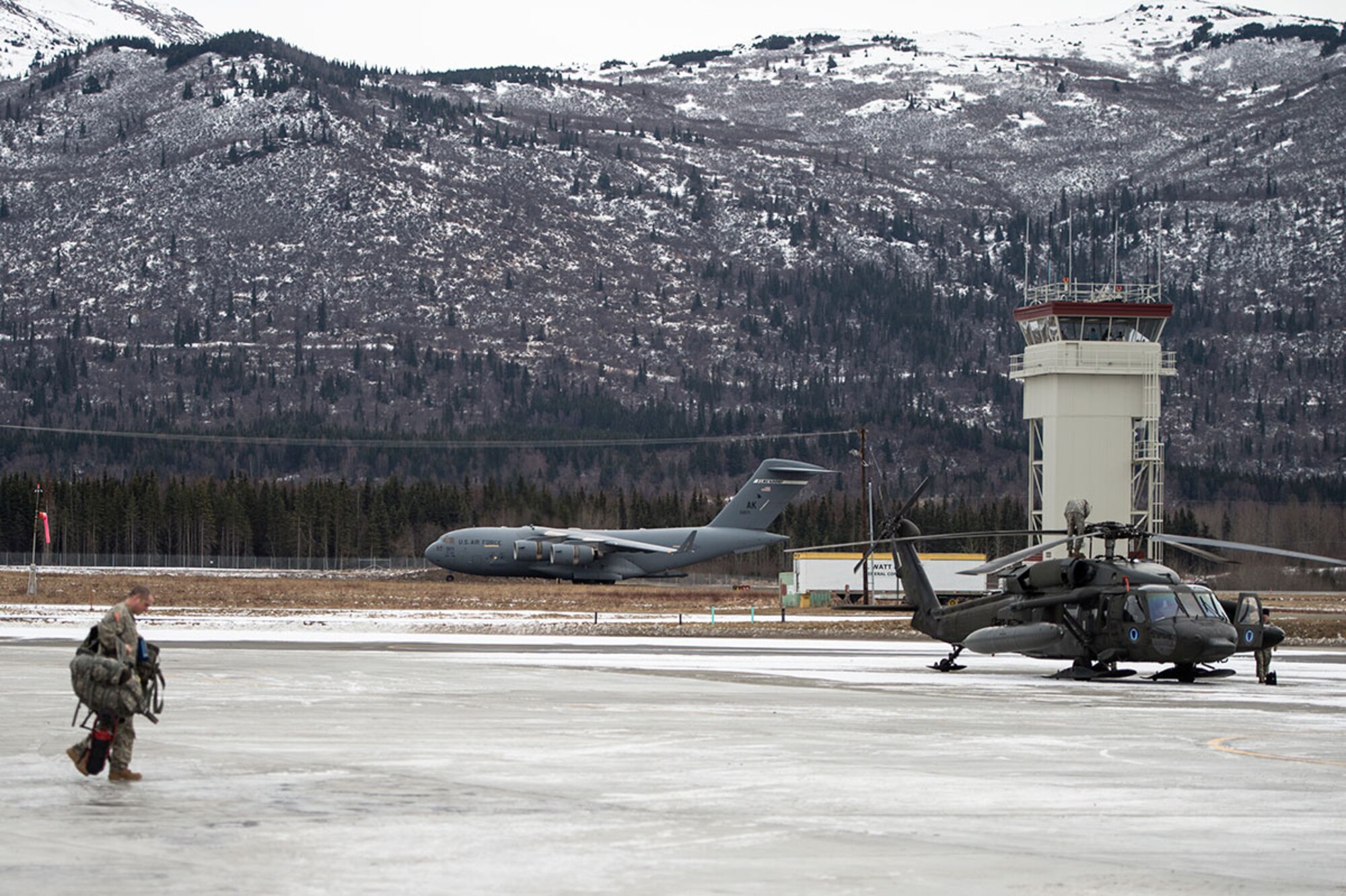 A U.S. Air Force C-17 Globemaster III from the 517th Airlift Squadron takes off from Bryant Army Air Field on Joint Base Elmendorf-Richardson, Alaska,  March 7, 2016.  The event marked the first time a C-17 has taken off from the airfield since its construction in 1958, when the runway was built by the U.S. Army on then-separate Ft. Richardson to support Soldiers in remote areas of Alaska. (U.S. Air Force photo by Senior Airman James Richardson)