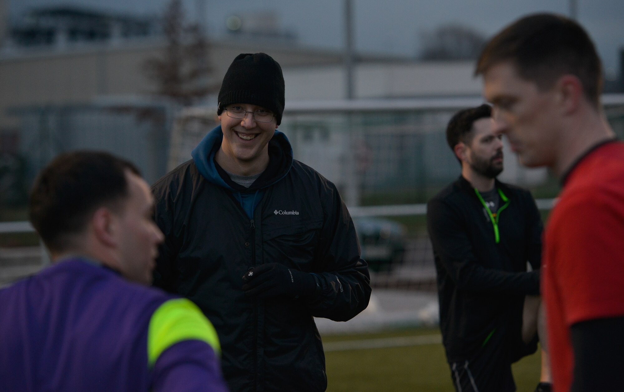 First Lt. Sean Miller, 7th Weather Squadron chief of education and training, approaches his players and talks with them before soccer practice Mar. 3, 2016, at U.S. Army Garrison Wiesbaden, Germany. Before starting practice, Miller communicates with players to share his expectations for how practice will run. (U.S. Air force photo/Airman 1st Class Lane T. Plummer)