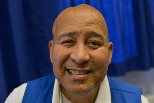 Wilbur Boulware poses for a photo Mar. 8, 2016, at Landstuhl Regional Medical Center’s Traumatic Brain Injury & Rehabilitation Clinic. Boulware, a patient and an American Red Cross volunteer, served in the U.S. Army for 24 years before suffering from a stroke, and is now a friendly face to people that walk into the clinic. (U.S. Air Force photo/Airman 1st Class Lane T. Plummer) 