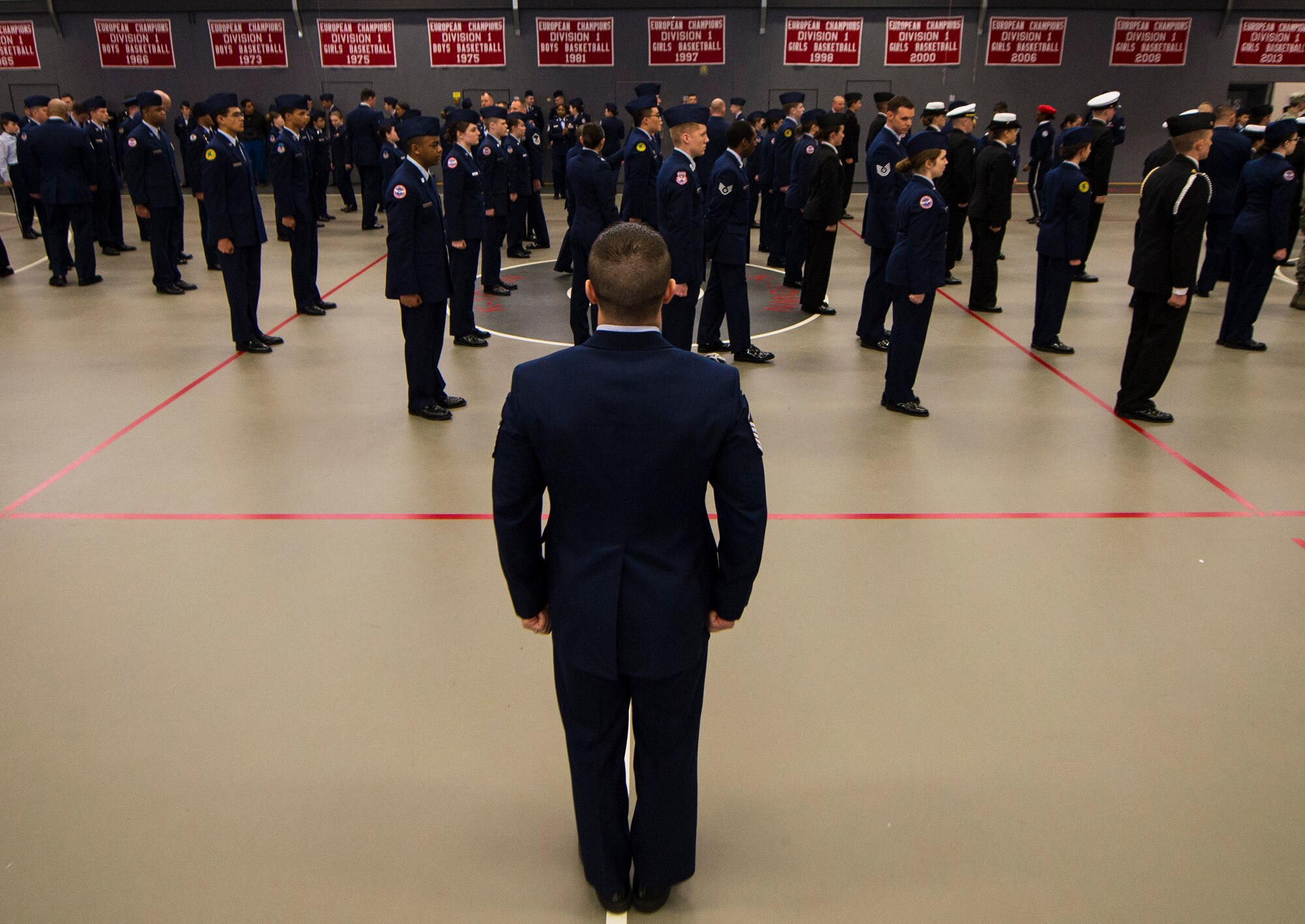 Cadets from 11 junior ROTC drill teams compete during an individual drill routine as part of the annual Department of Defense Education Activity Europe drill team championship held on Vogelweh, Germany, March 5, 2016. Other categories cadets competed in include saber and rifle exhibitions for solo performers, duos and drill teams. (U.S. Air Force photo/Senior Airman Jonathan Stefanko)