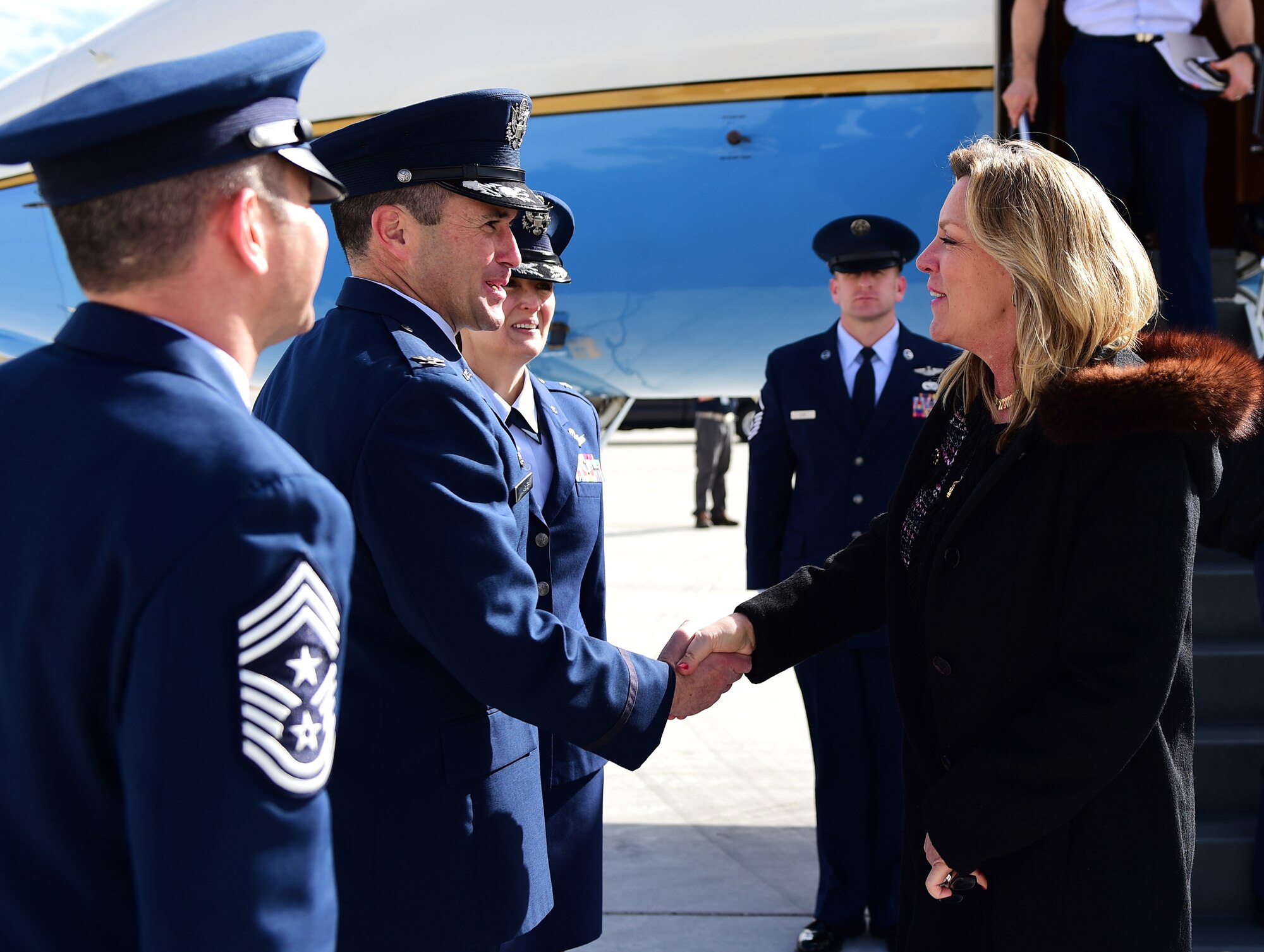 Deborah Lee James, Secretary of the Air Force, shakes hands with Col. John Wagner, 460th Space Wing commander, March 8, 2016, on Buckley Air Force Base, Colo. James met local leadership prior to attending a meeting with Department of Defense and industry leadership event. (U.S. Air Force photo by Senior Airman Racheal E. Watson/Released)
