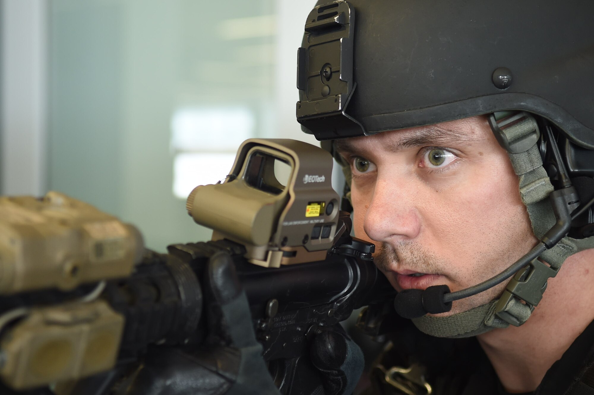 Staff Sgt. Adam Cooper, 11th Security Forces Squadron Emergency Services Team operator, clears a building during an active shooter exercise on Joint Base Andrews, Md., March 9, 2016. These exercises  help law enforcement and emergency response Airmen train, and teach military and civilian employees to stay vigilant of their surroundings. (U.S. Air Force photo by Senior Airman Mariah Haddenham/Released)