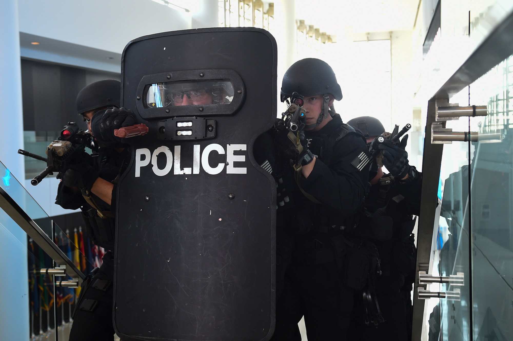 11th Security Forces Squadron Emergency Services Team operators perform a three- man stack with a shield man during an active shooter exercise on Joint Base Andrews, Md., March 9, 2016. Conducting exercises like these help law enforcement and emergency response Airmen train, and teach military and civilian employees to stay vigilant of their surroundings. (U.S. Air Force photo by Senior Airman Mariah Haddenham/Released)