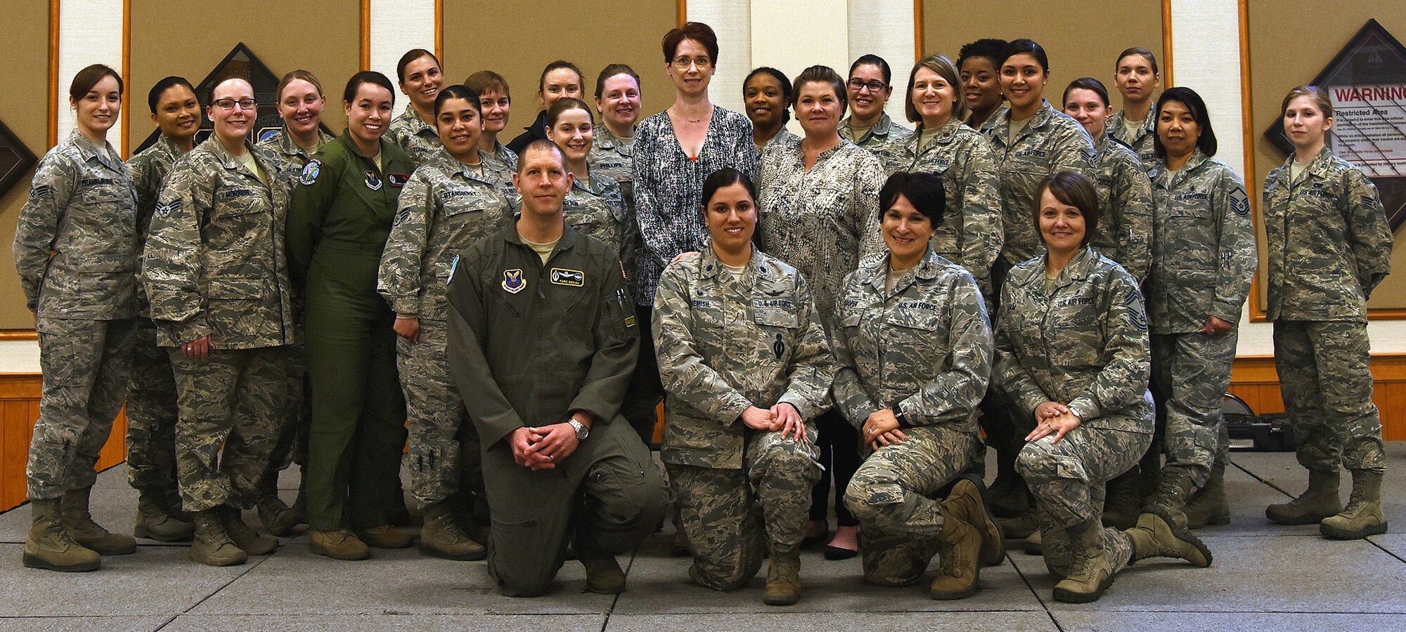 Attendees and speakers from the military and the surrounding Great Falls community pose for a group photo at the first ever women’s leadership symposium at Malmstrom Air Force Base, Mont., March 8, 2016, at the Grizzly Bend. The goal of the conference was to build leadership skills, find mentors and network with other members in the community and across the military. (U.S. Air Force photo/Senior Airman Jaeda Tookes)