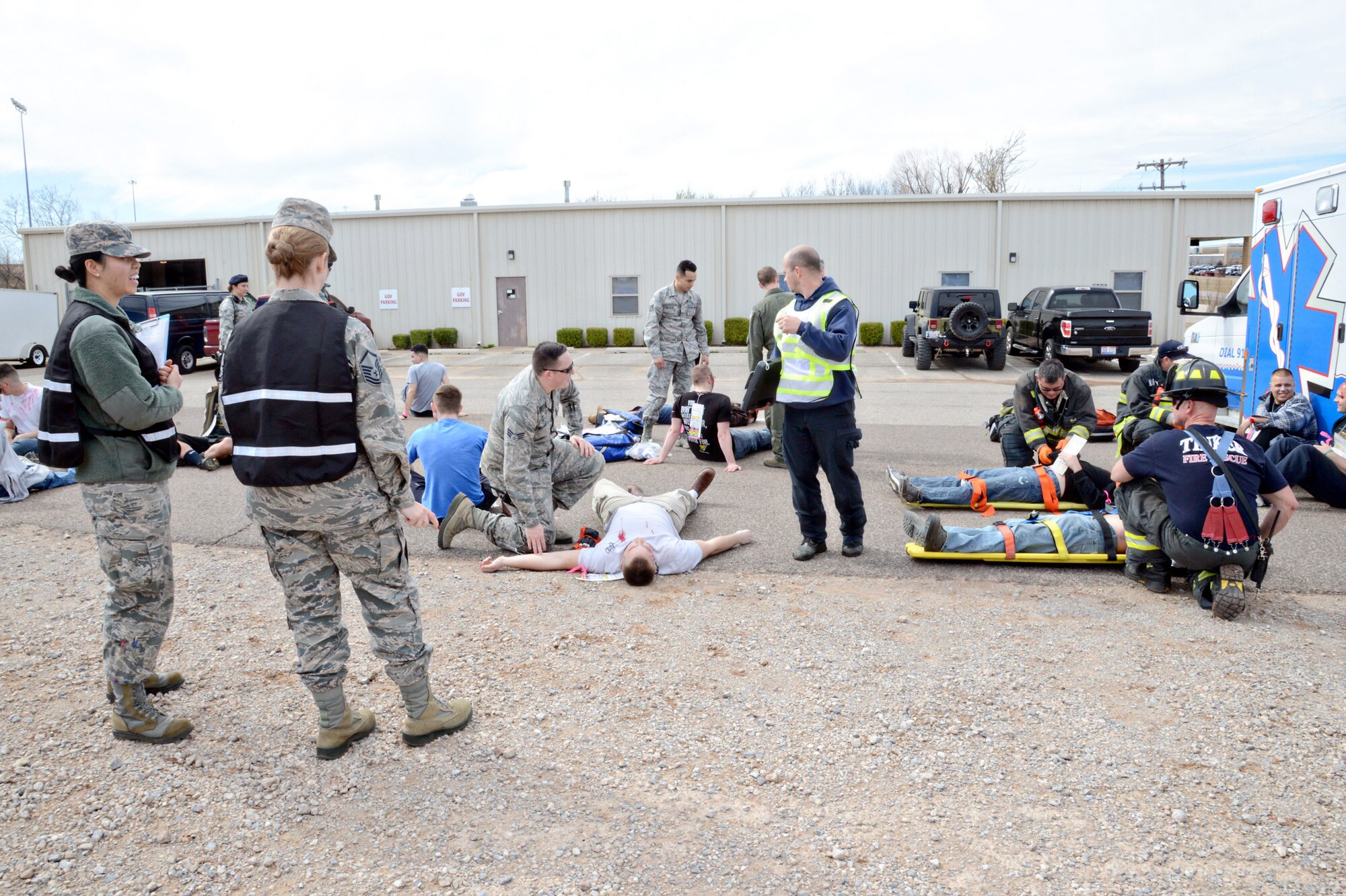 Inspectors with the 72nd Air Base Wing Inspector General’s office observe first responders helping injured victims in a triage area. (Air Force photo by Kelly White)