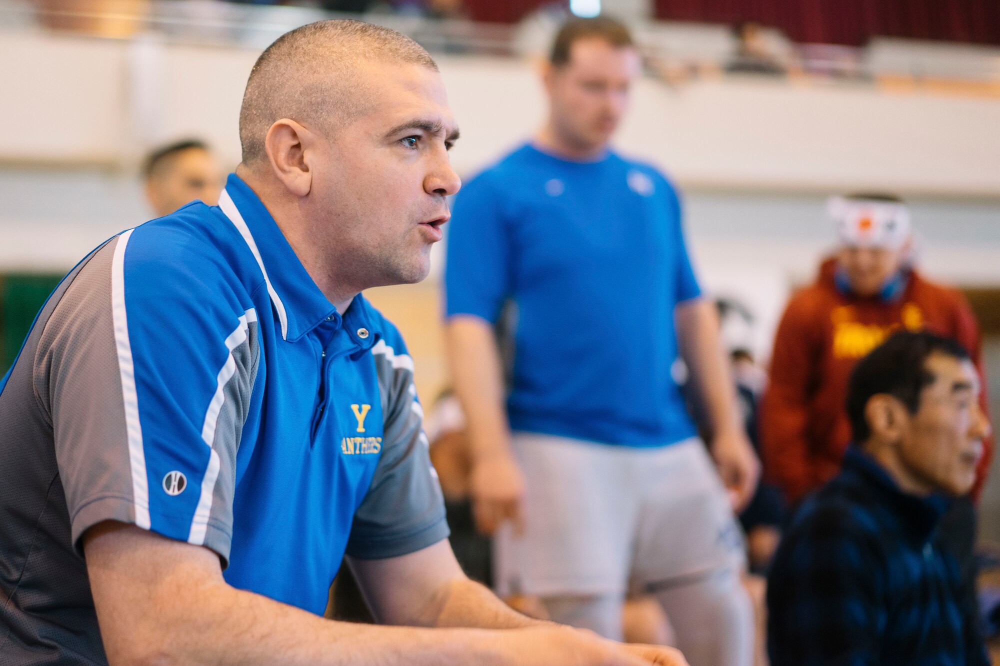 Lt. Col. James Cunningham, 374th Comptroller Squadron commander, coaches Capt. Steve Larson, 374th Operations Support Squadron current operations officer, during the Japan Ground Self-Defense Force All Japan Masters Wrestling Games competitor, March 5, 2016, at Camp Asaka, Japan. Cunningham and Larson, coaches of the Yokota High School wrestling team, utilized the event to practice what they preached to their athletes and rekindle their competitive spirit. (U.S. Air Force photo