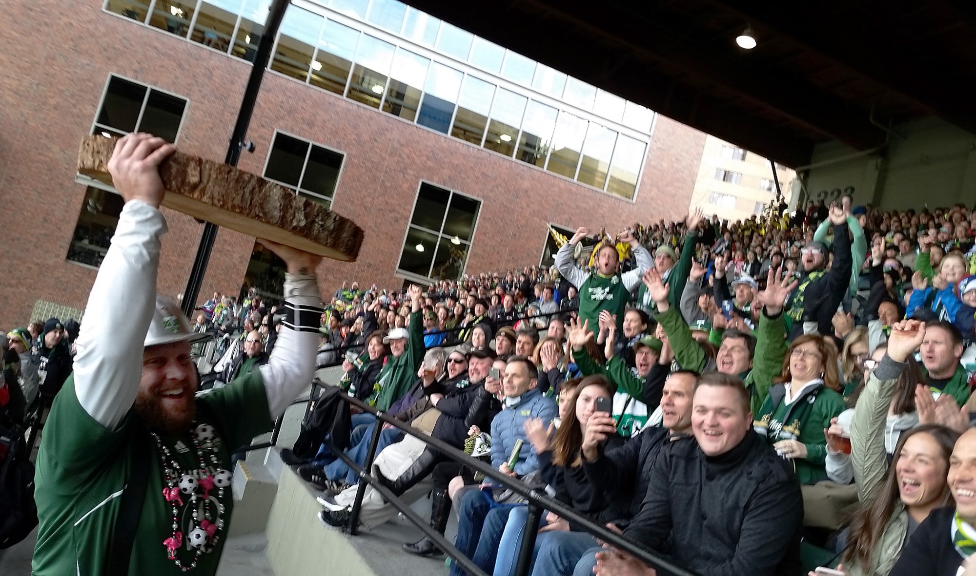 Portland Timbers FC mascot, ‘Timber Joey” shows a slice from the log he cut to fans to celebrate the first goal scored by Portland Timber Diego Valeri, during the match between the Portland Timbers and the Columbus Crew SC, Providence Park, Portland, Ore., Mar. 6, 2016. Coincidently, the Timbers won the opening 2016 match the same way they won their first title match on Dec. 6, 2015, by beating the Crew with the same 2-1 score. (U.S. Air National Guard photo by Tech. Sgt. John Hughel, 142nd Fighter Wing Public Affairs)