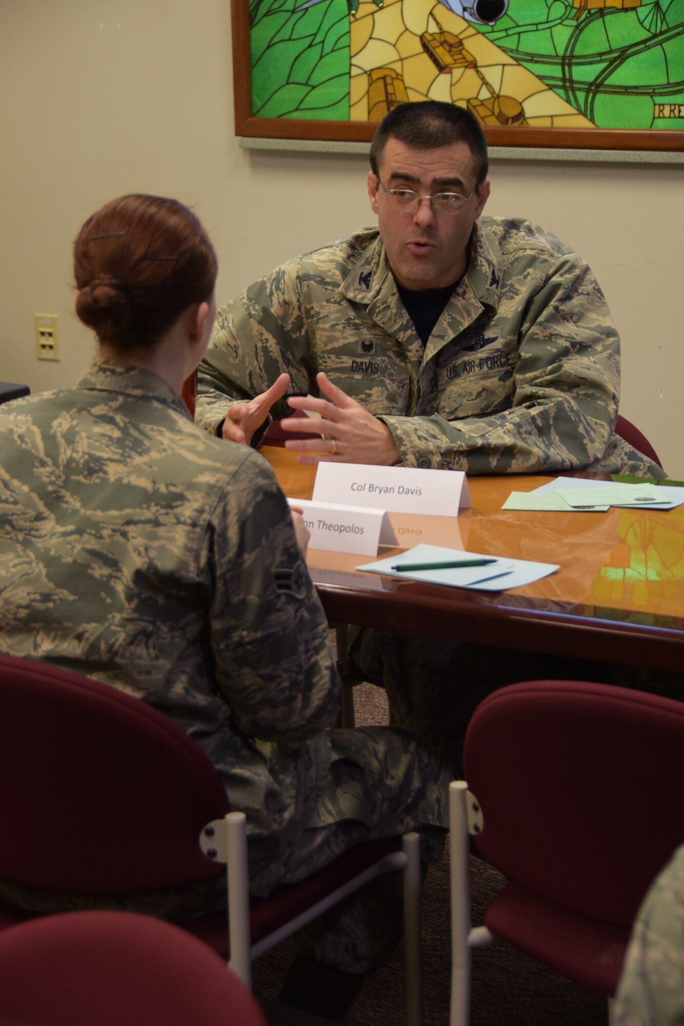 178th Wing Commander Col. Bryan Davis mentors Airman 1st Class Kathrynn Theopolos from the178th Medical Group at the Springfield Air National Guard Base March 6, 2016. They participated in a wing-wide speed mentoring session where Airmen rotated stations every few minutes to receive mentoring from different base leaders . (Ohio Air National Guard photo by Master Sgt. Seth Skidmore)