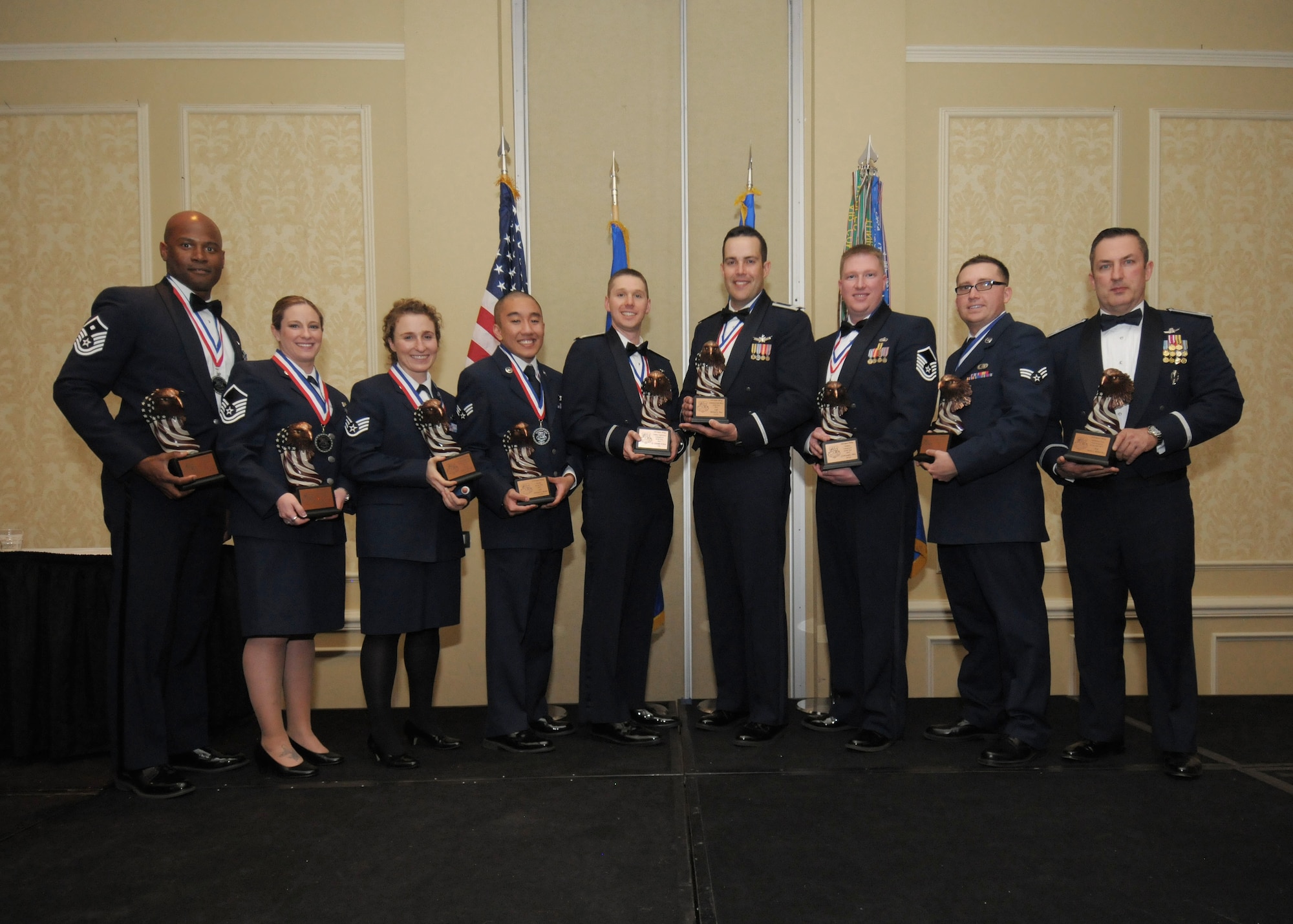 The 310th Space Wing annual award winners pose with their trophies  after the annual awards banquet at the Antlers Hotel in Colorado Springs, Colo., March 4, 2016. The wing sponsored the event to both recognize its annual award winners and bring Reservists together to enjoy an evening of esprit de corps, unit morale and camaraderie. (U.S. Air Force photo/Tech. Sgt. Sarah Corrice) 