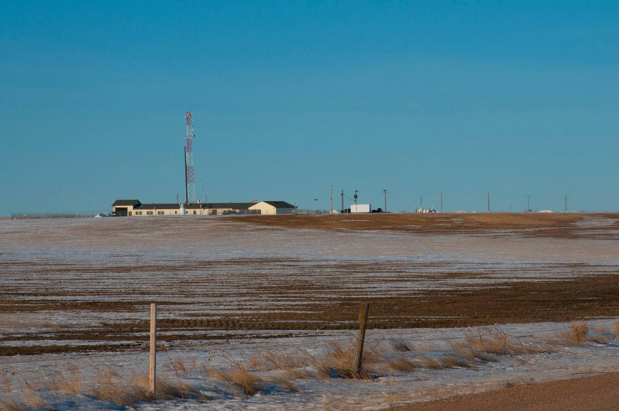 A Missile Alert Facility quietly rests amongst the hills in the F.E. Warren Air Force Base, Wyo., missile complex. 24/7, 365 days a year, the topside buildings houses support forces, while missileers work underground, manning launch control centers. (U.S. Air Force photo by Senior Airman Jason Wiese)