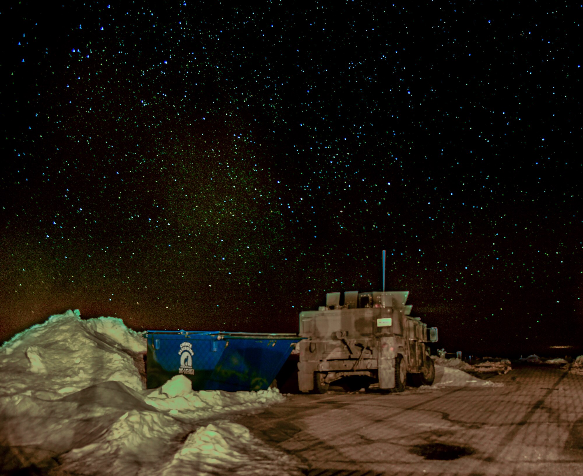 A 90th Missile Security Forces Squadron Humvee sits on the access road of a Missile Alert Facility in the F.E. Warren Air Force Base, Wyo., missile complex, in this composite of two photos taken on Feb. 8, 2016. Security forces, missileers and other 90th Missile Wing Airmen stay vigilant 24/7. (U.S. Air Force photo illustration by Senior Airman Jason Wiese)