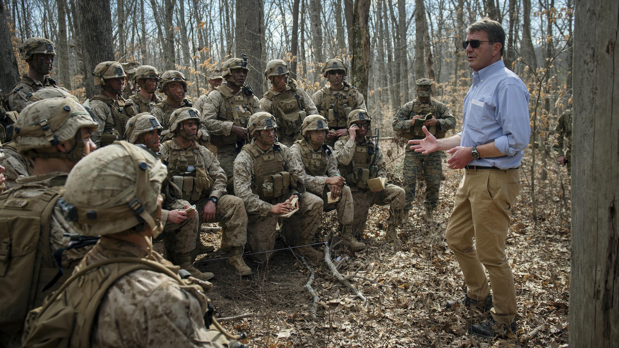 Marines at The Basic School participating in a a platoon in defense demonstration at Marine Corps Base Quantico, Va., take a break from training in order to speak with Secretary of Defense Ash Carter as he visits the base March 9, 2016. He visited the base to observe Marine Corps training and speak with Marines March 9, 2016.(DoD photo by Senior Master Sgt. Adrian Cadiz)